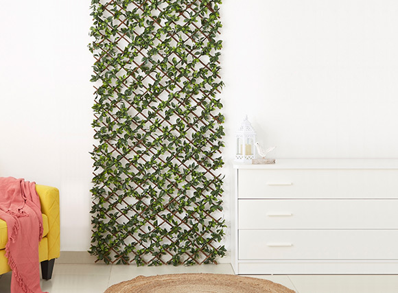 Artificial green climber on a metal frame 